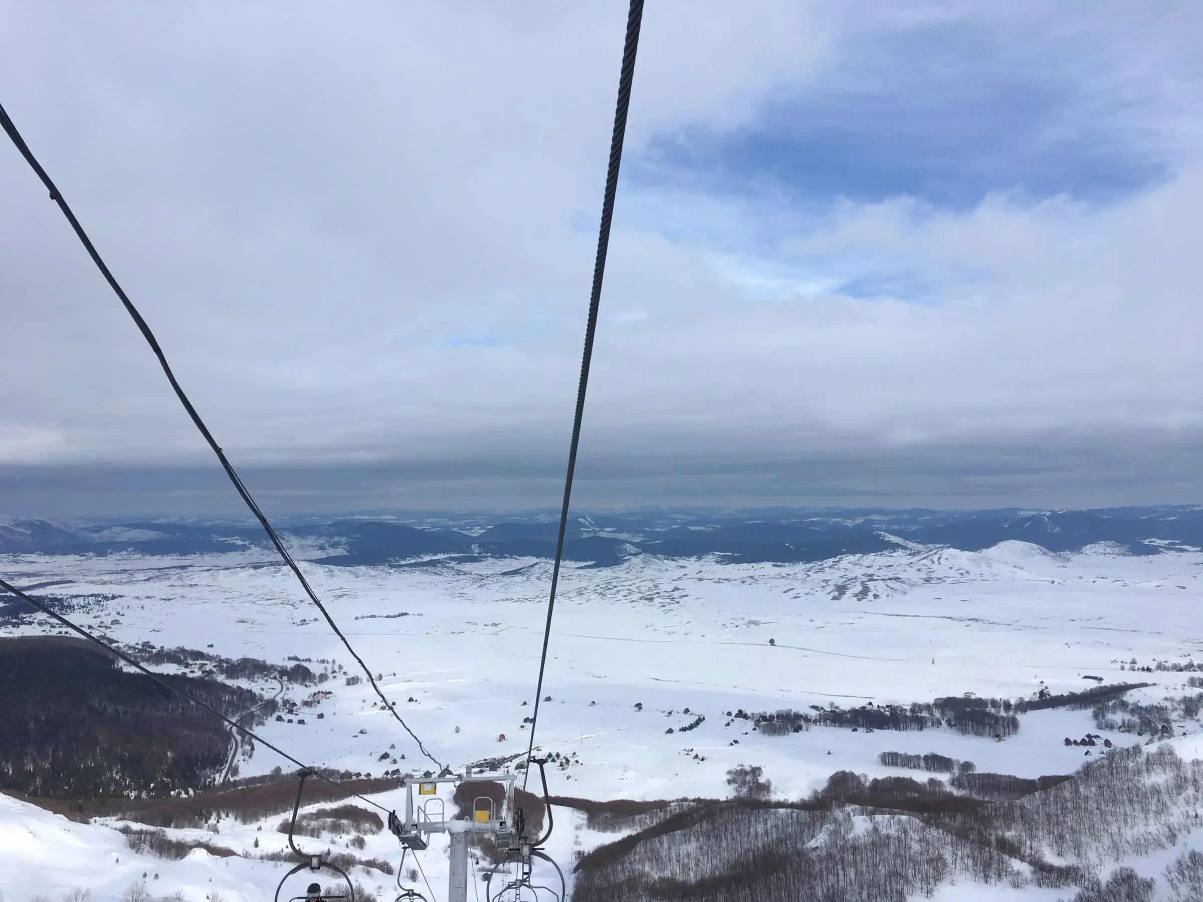 Snow-covered Žabljak plateau seen from a Durmitor ski chairlift in February