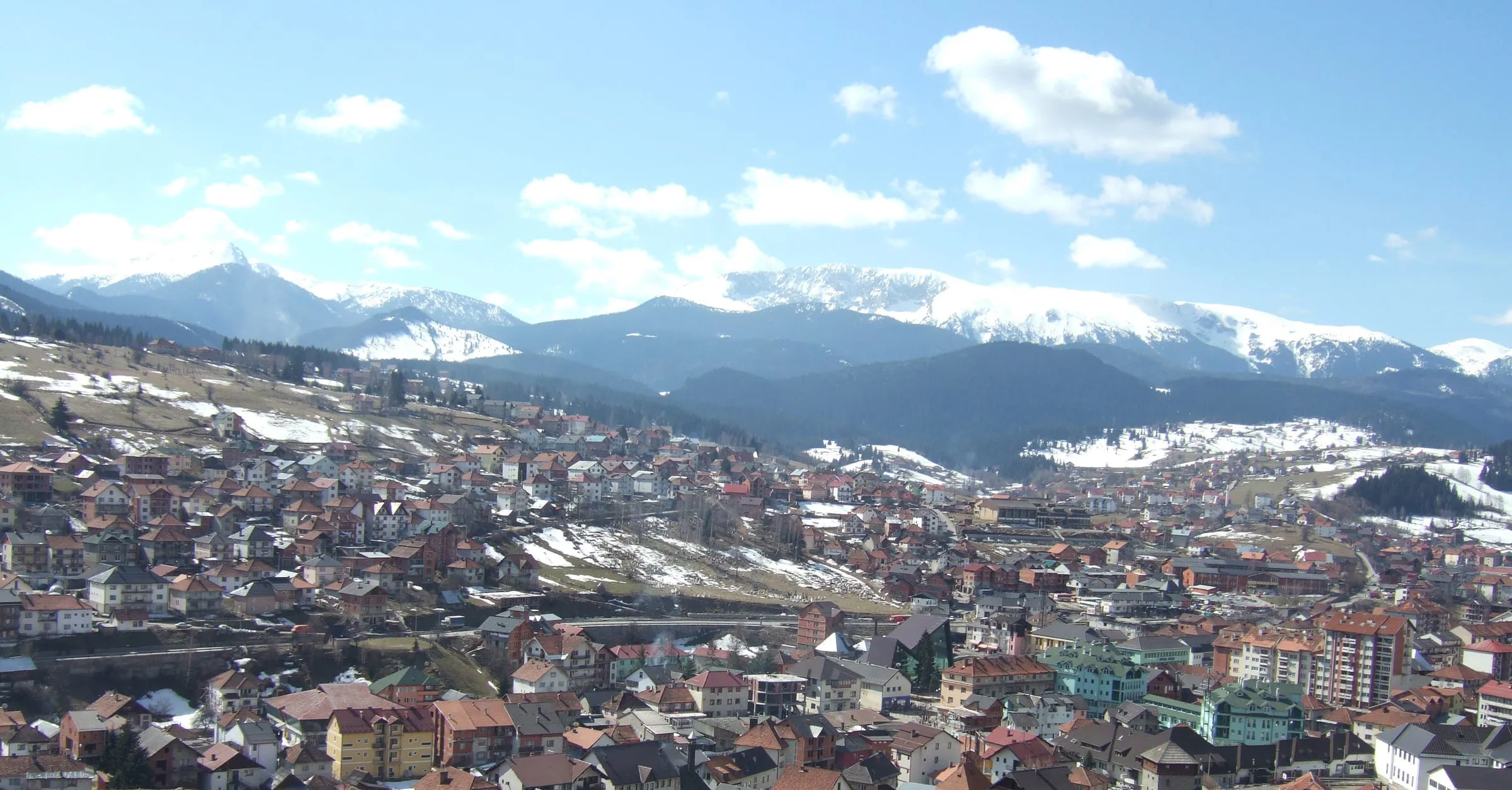 Rožaje town with snowy Hajla range in early spring